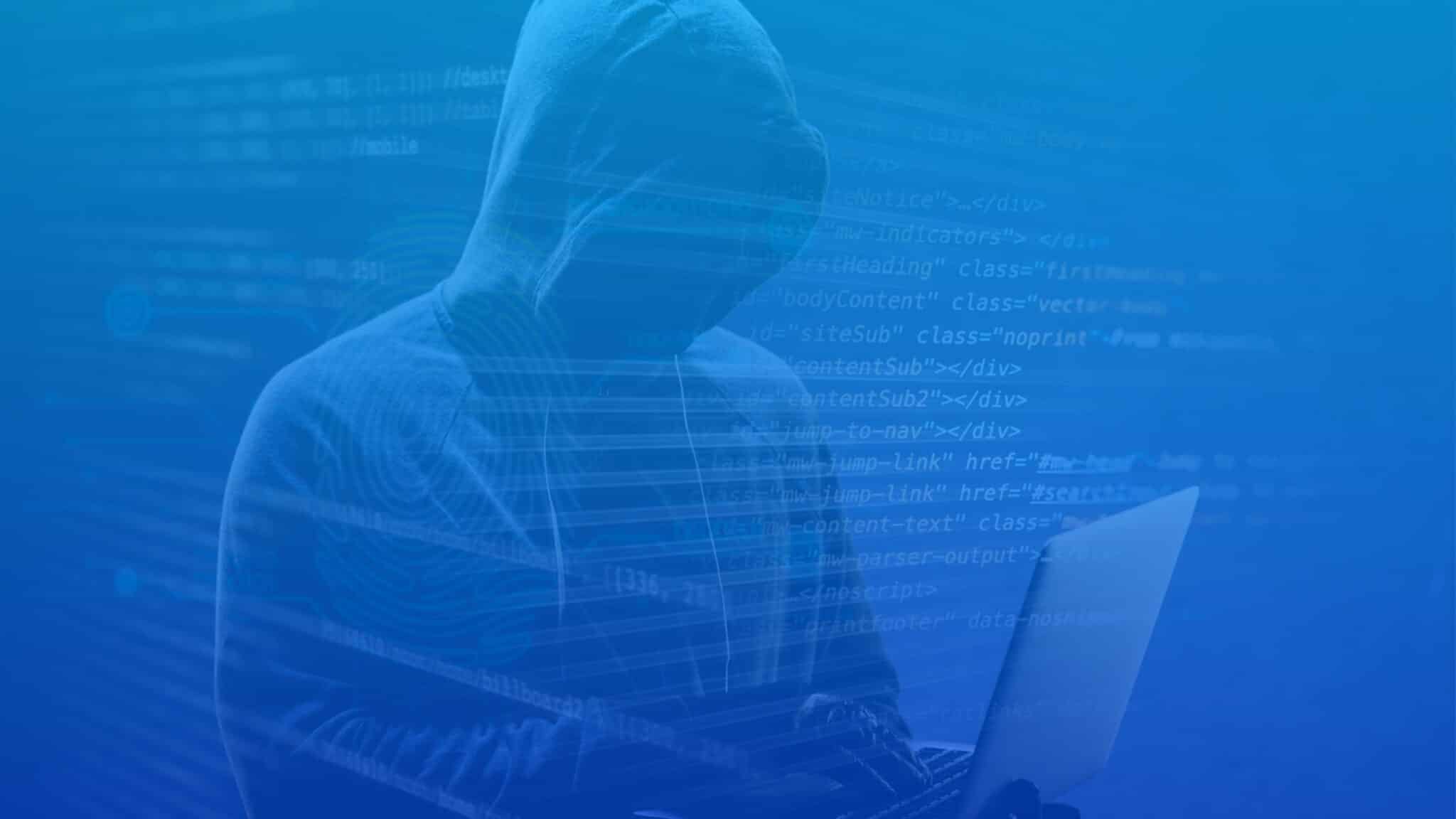 Hooded figure at a laptop with digital code overlay, representing security leaders addressing cybersecurity strategy challenges.